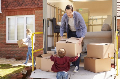 Packed boxes and furniture prepared for a small removals service