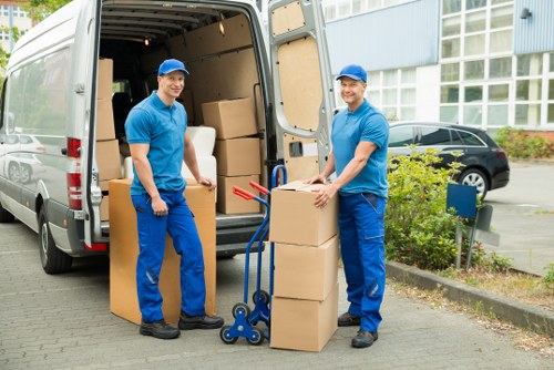 Removal team handling a Bromley home move with furniture and packing supplies